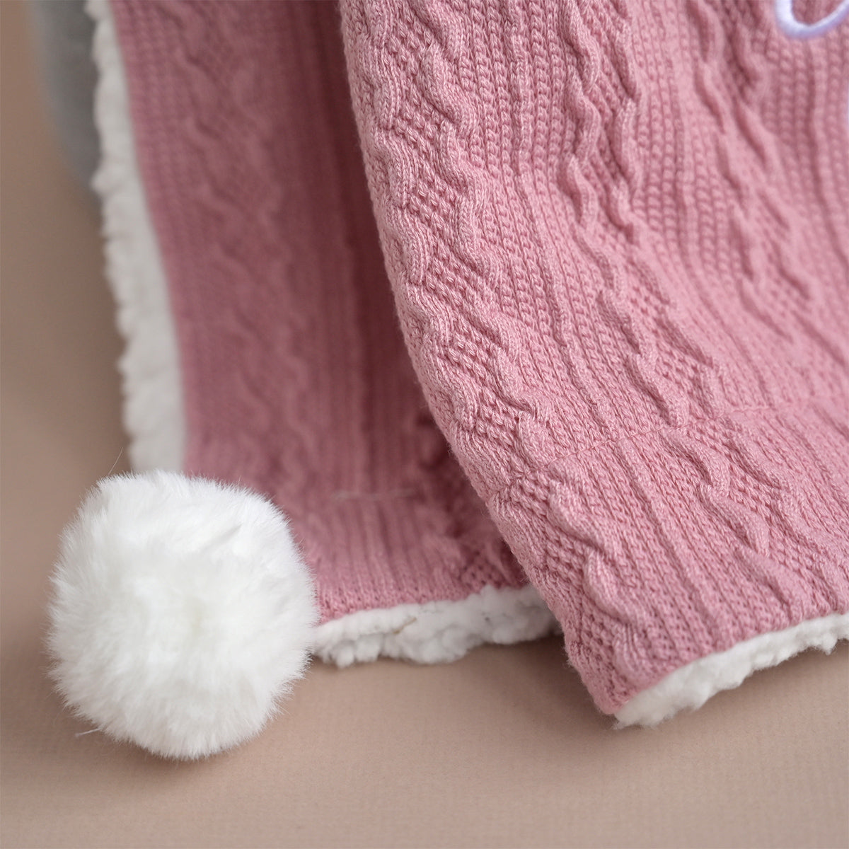 knitted blanket with pom pom for girls