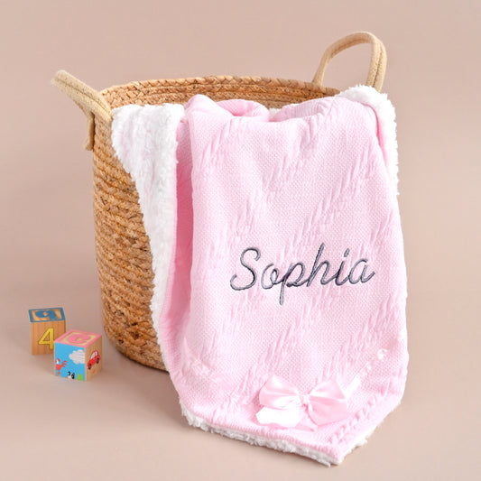 baby pink knitted blanket with bow