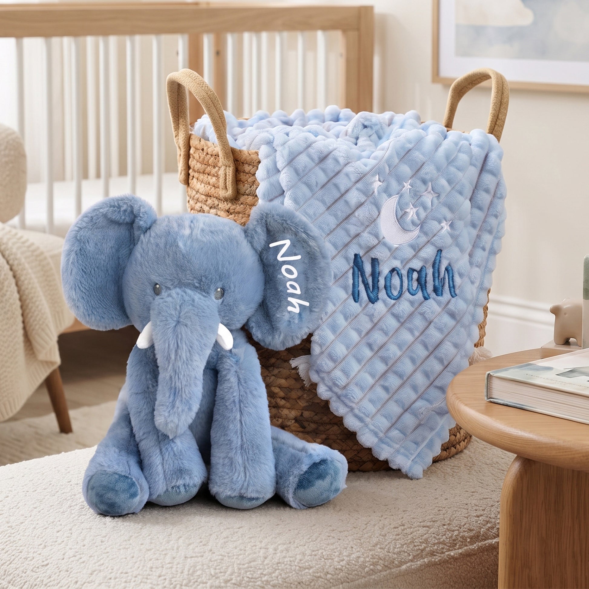 Personalised blue elephant toy made from recycled materials with name "Noah" embroidered on the ear, alongside a matching embossed blanket
