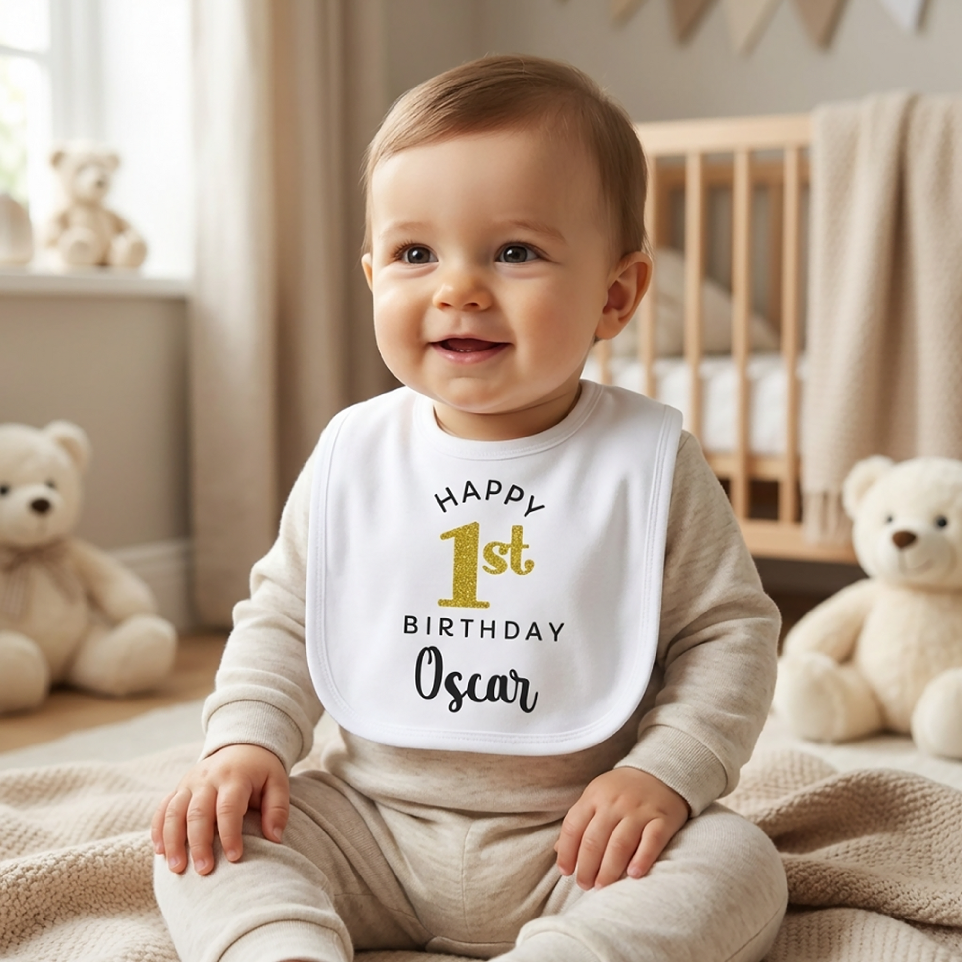 White 1st birthday baby bib with gold glitter "Happy 1st Birthday" print in black lettering