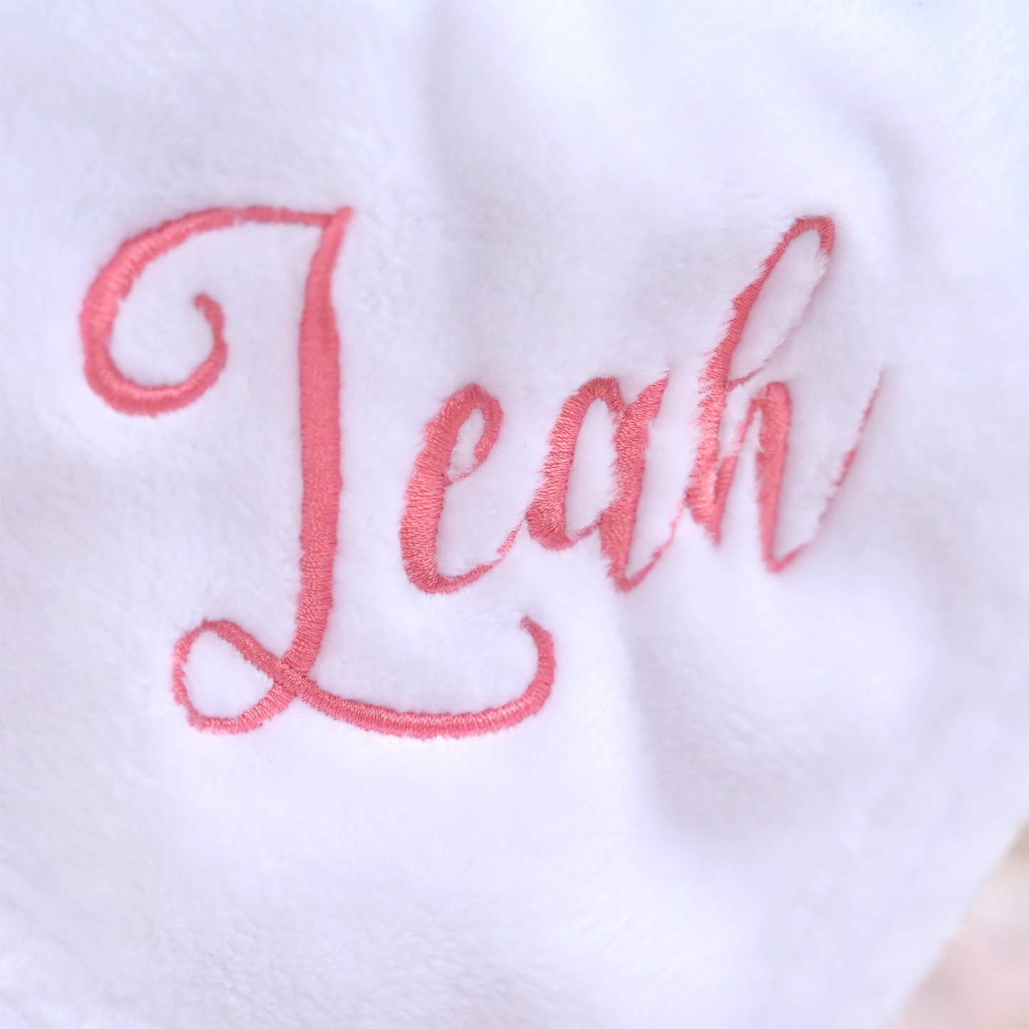 embroidered Leah name on white elephant  baby comforter